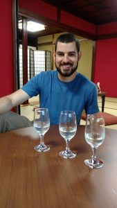 Ryan tasting three types of sake in Takayama.